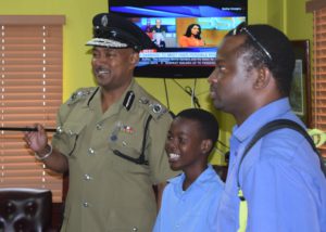 Saddlers Primary School student with Commissioner Queeley in office