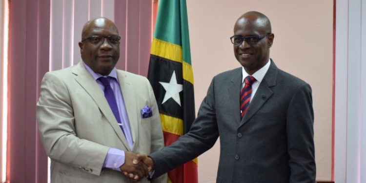 PM HARRIS RECEIVES COURTESY CALL FROM HIS LORDSHIP JUSTICE TREVOR WARD, QC AND PRESENTS HIM WITH LEADING LAW BOOKS