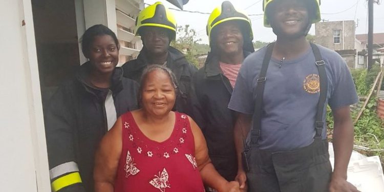 FIRE AND RESCUE SERVICES LENDS HELPING HAND TO HURRICANE-AFFECTED SENIOR CITIZEN