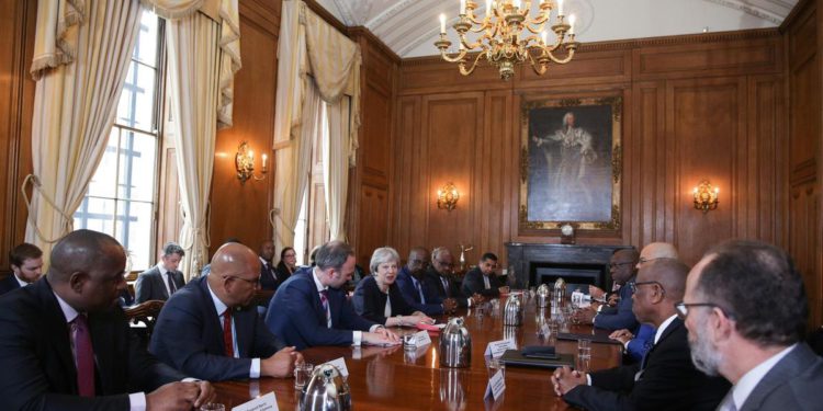 PM HARRIS SAYS APOLOGIES BY UK PM THERESA MAY AND HOME SECRETARY AMBER RUDD MARK THE START OF THE DIALOGUE ON THE WINDRUSH MATTER