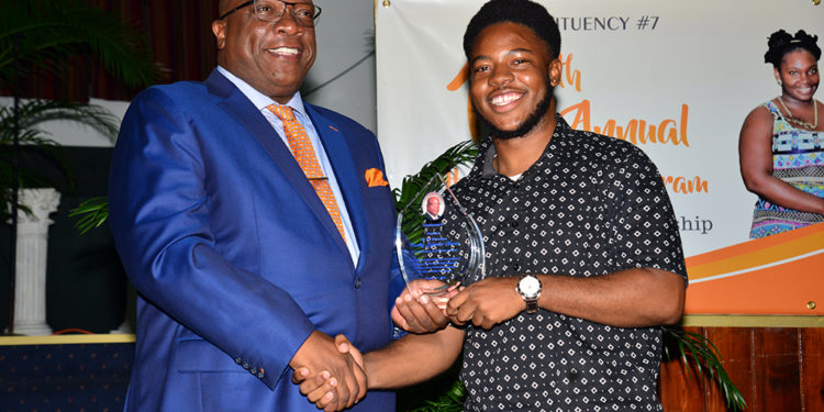 PAST HELP-A-CHILD RECIPIENT THANKS PM HARRIS FOR HELPING TO POSITIVELY SHAPE HIS FUTURE