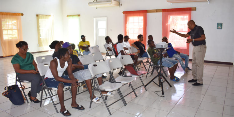 Dr Chitan empowering Nevis STEP environmental workers through social skill training