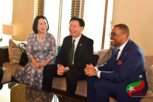 Minister Brantley (right) shares a light moment with H.E. Wu, his wife, and other dignitaries