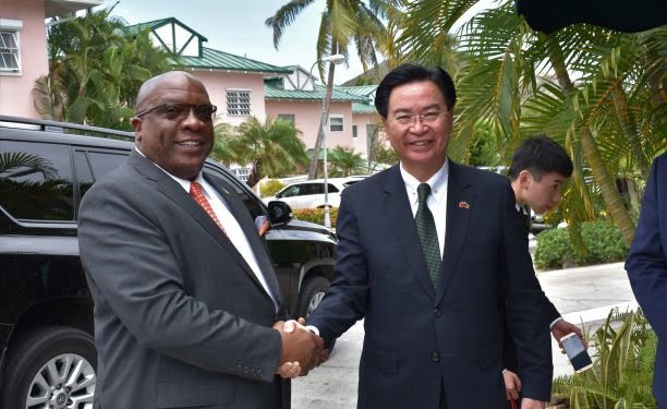 Prime Minister Dr. the Hon. Timothy Harris greets Minister of Foreign Affairs of the Republic of China (Taiwan), the Honourable Dr. Jaushieh Joseph Wu.