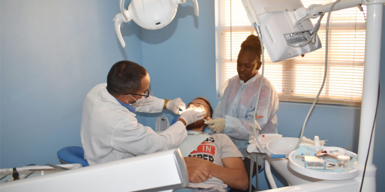 Restoring smiles: Nevis-based dental technician partners with Development Bank