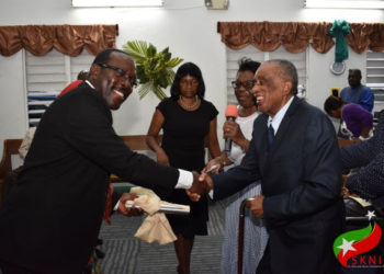 PM HARRIS CONGRATULATES MICHAEL PENNY ON HIS INSTALLATION AS PASTOR OF THE MOUNT CARMEL BAPTIST CHURCH