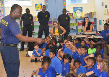 FIRE OFFICERS TEACH CHILDREN ABOUT FIRE SAFETY