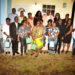 Back Row - Minister Hamilton (Left) and Prime Minister, Dr. the Honourable Timothy Harris (3rd right) along with NHC officials and new homeowners.
