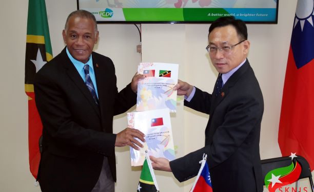 L-R: HON. ERIC EVELYN; H.E. AMBASSADOR MICHAEL LIN