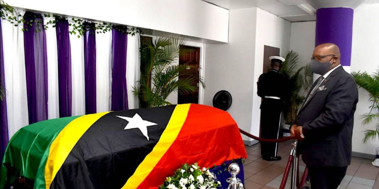 PM HARRIS CONSOLES THE FAMILY AS THE BODY OF HIS EXCELLENCY VANCE W. AMORY LIE IN STATE AT GOVERNMENT HEADQUARTERS